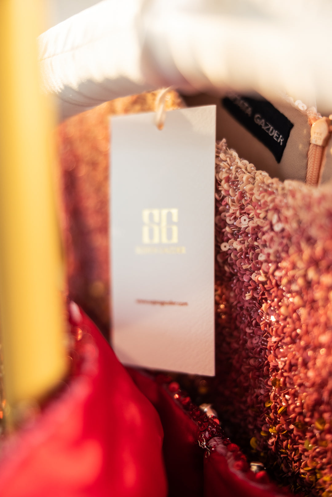 Close-up of a glittery product with a visible brand tag.