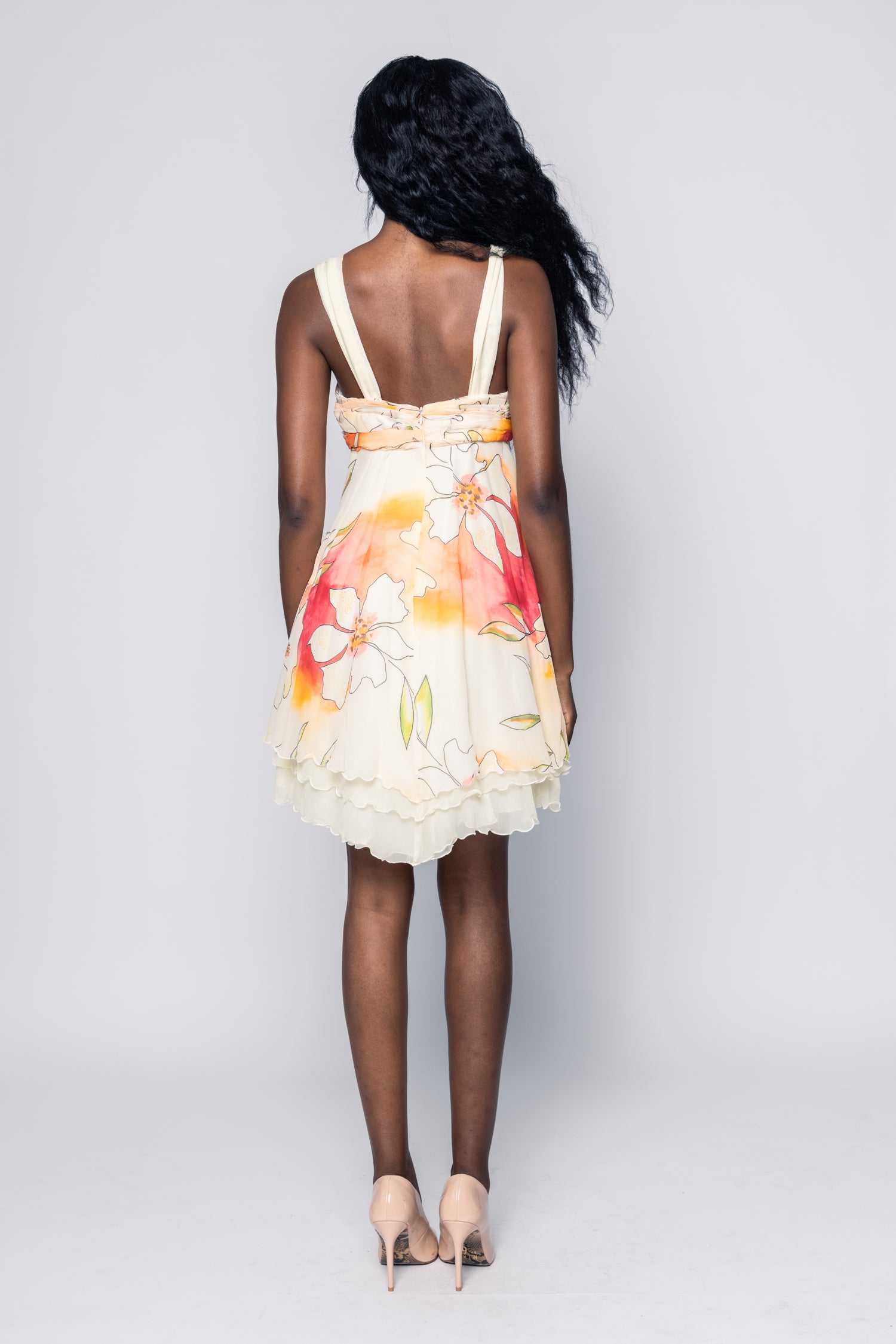 Woman wearing a floral dress on a white background