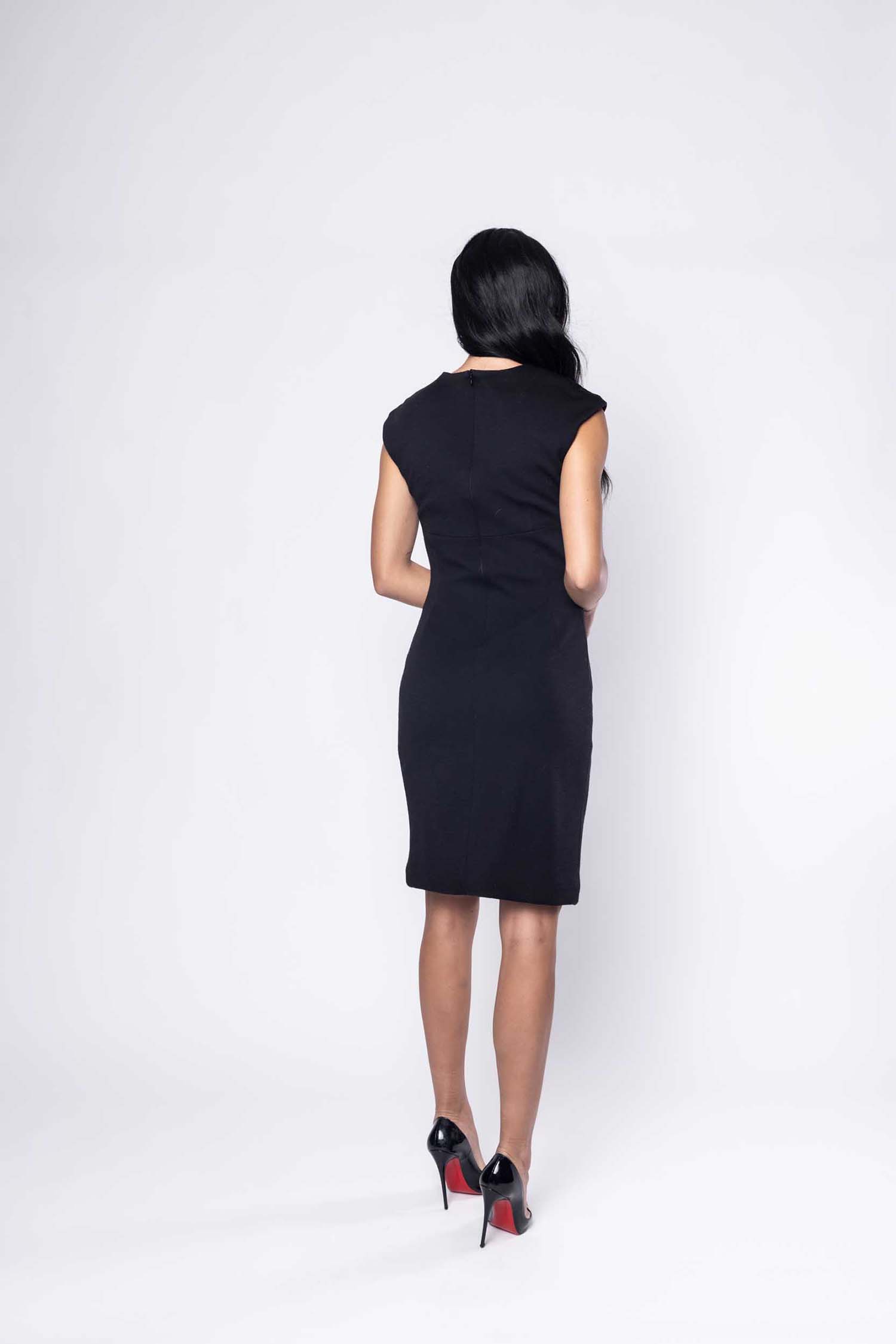 Beautiful model in black cocktail silk Sujata Gazder dress - back view