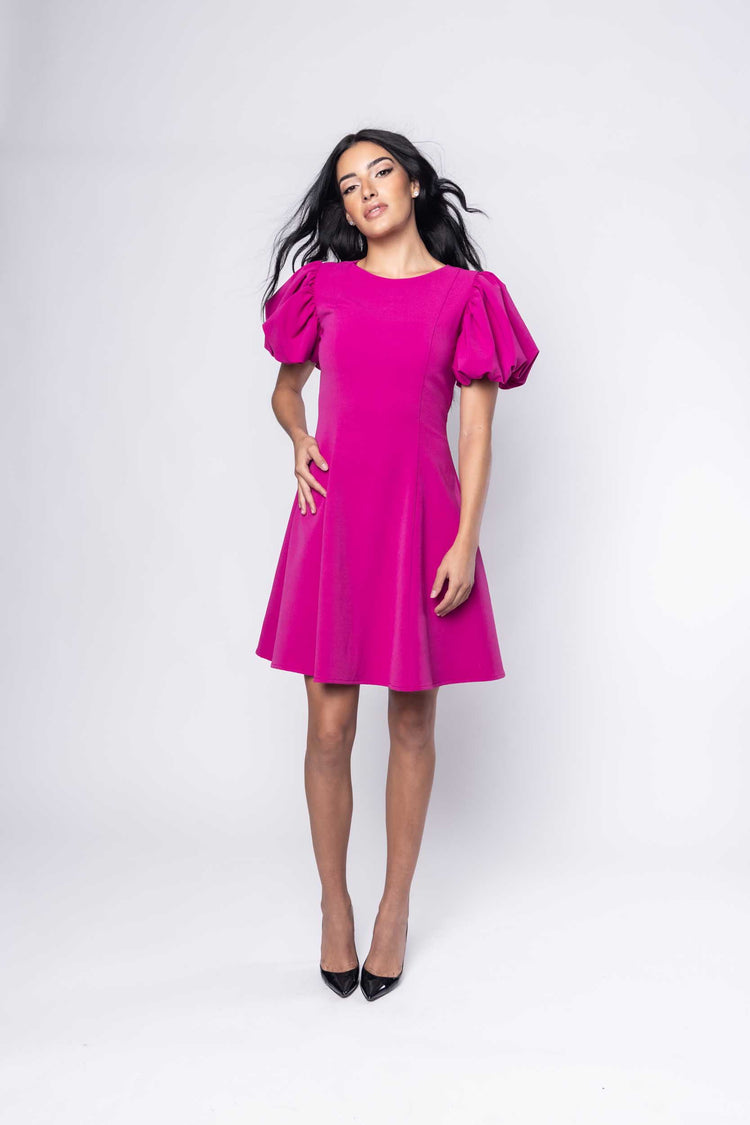 Beautiful model in fuchsia cocktail silk Sujata Gazder dress - front view movement