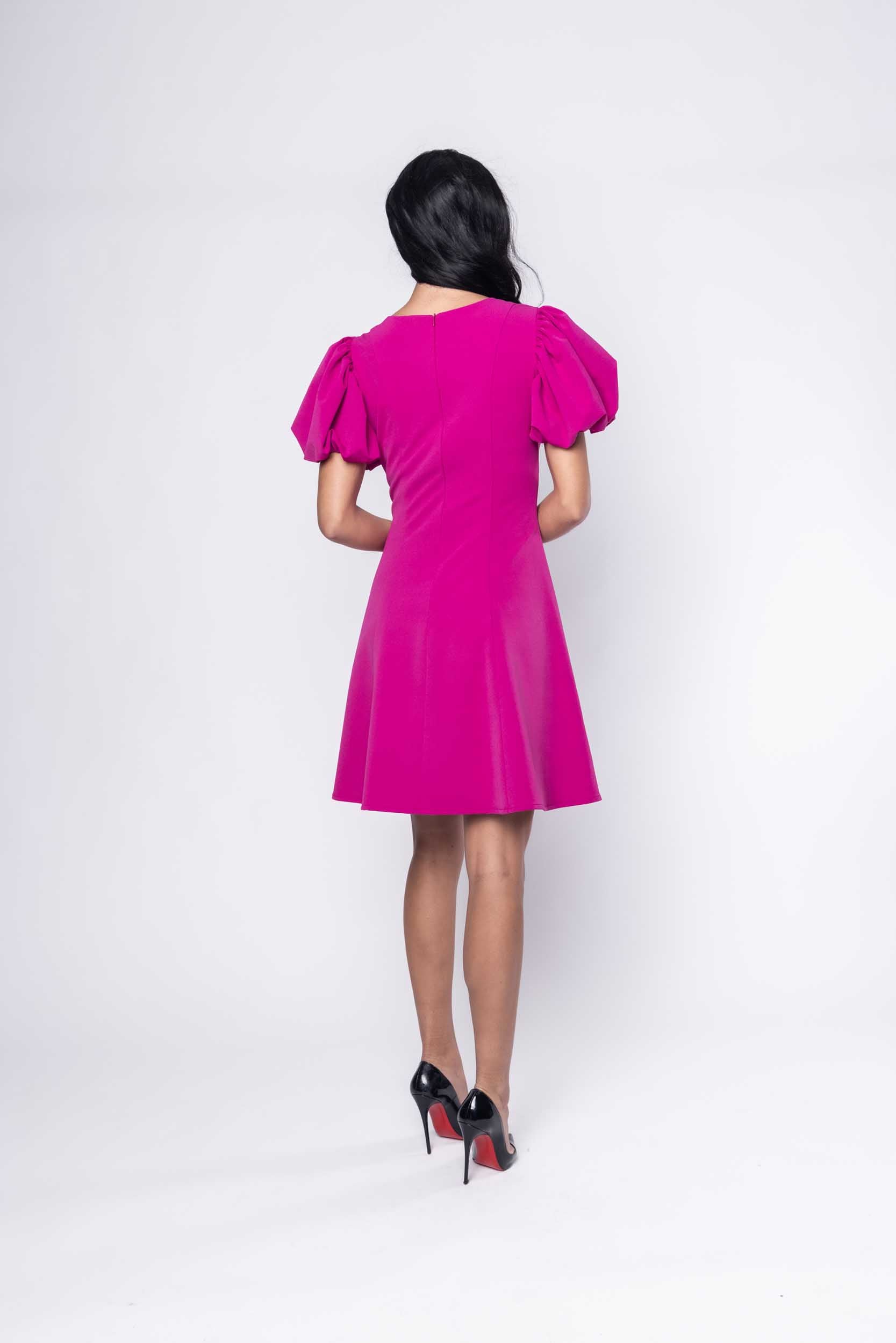 Beautiful model in fuchsia cocktail silk Sujata Gazder dress - back view