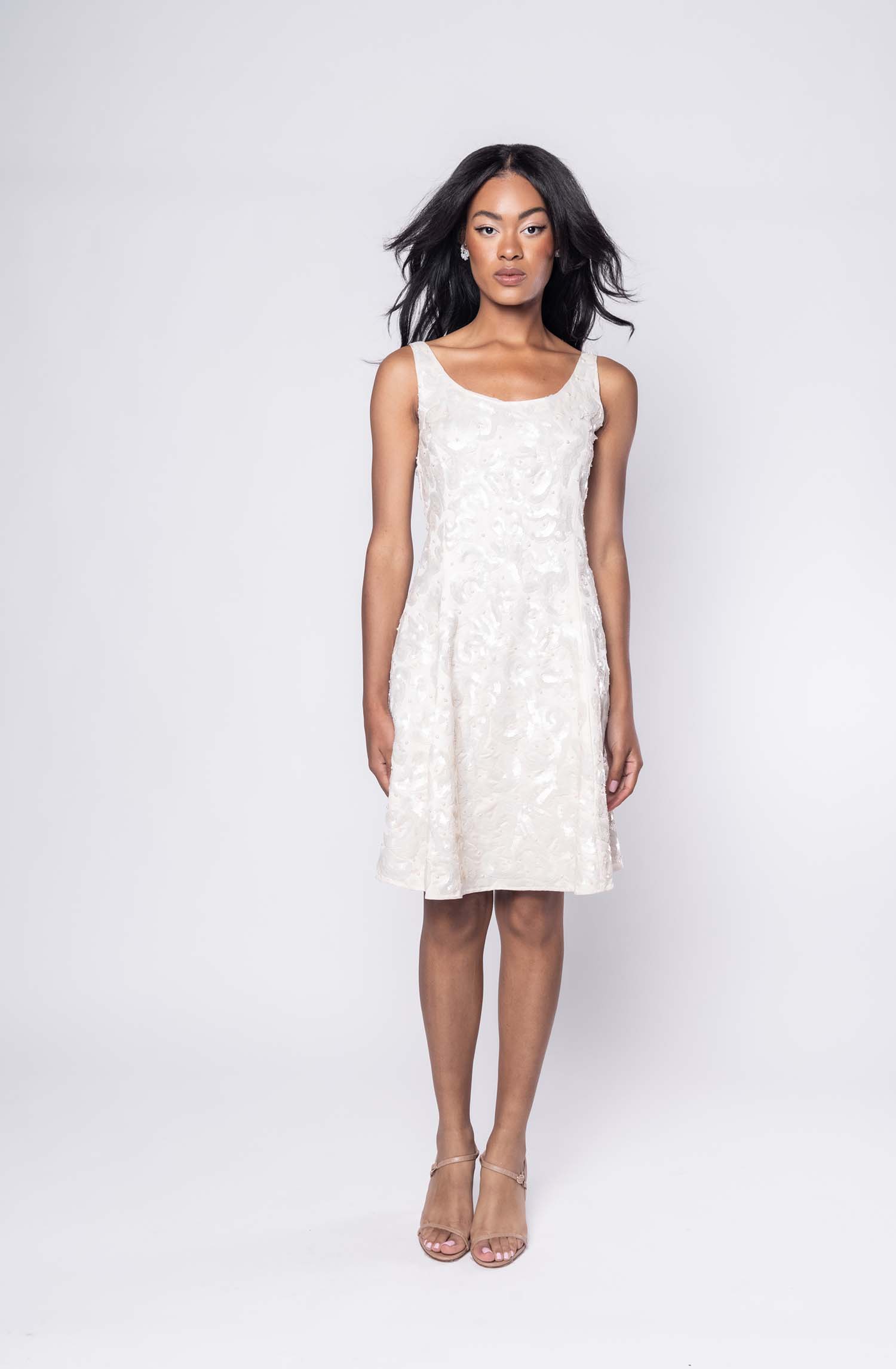 Gorgeous model in cream sequin embellished Isla cocktail dress - front view