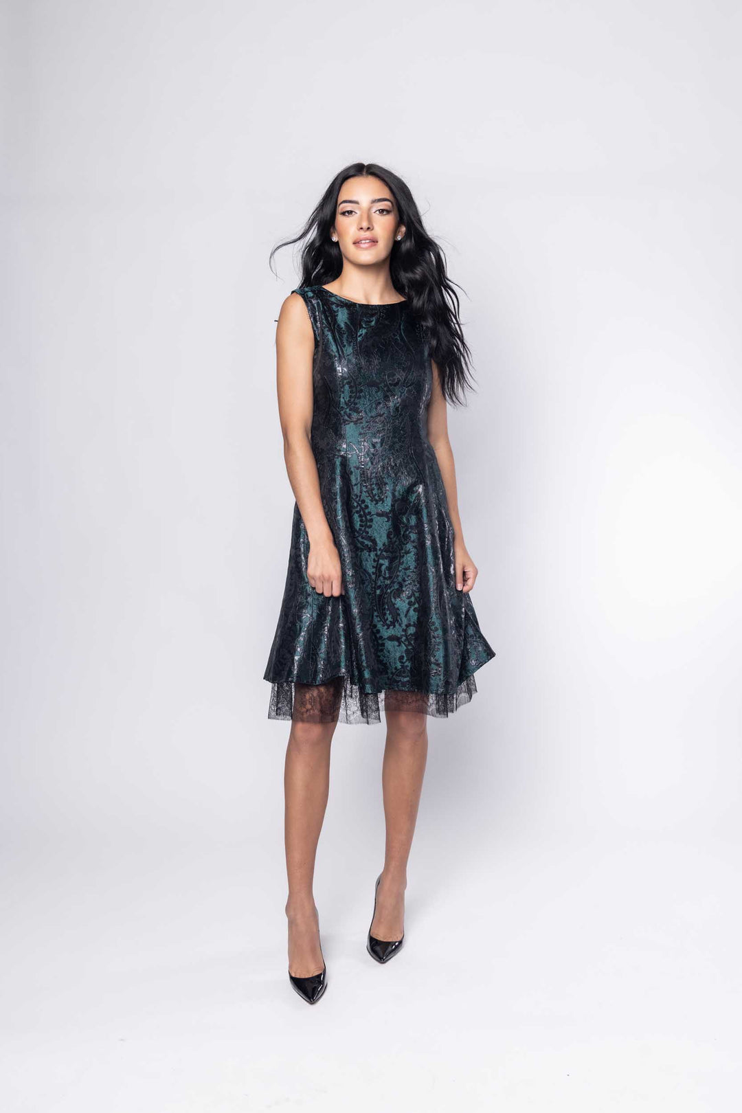 Beautiful model in a green metallic silk Sujata Gazder cocktail dress - front view