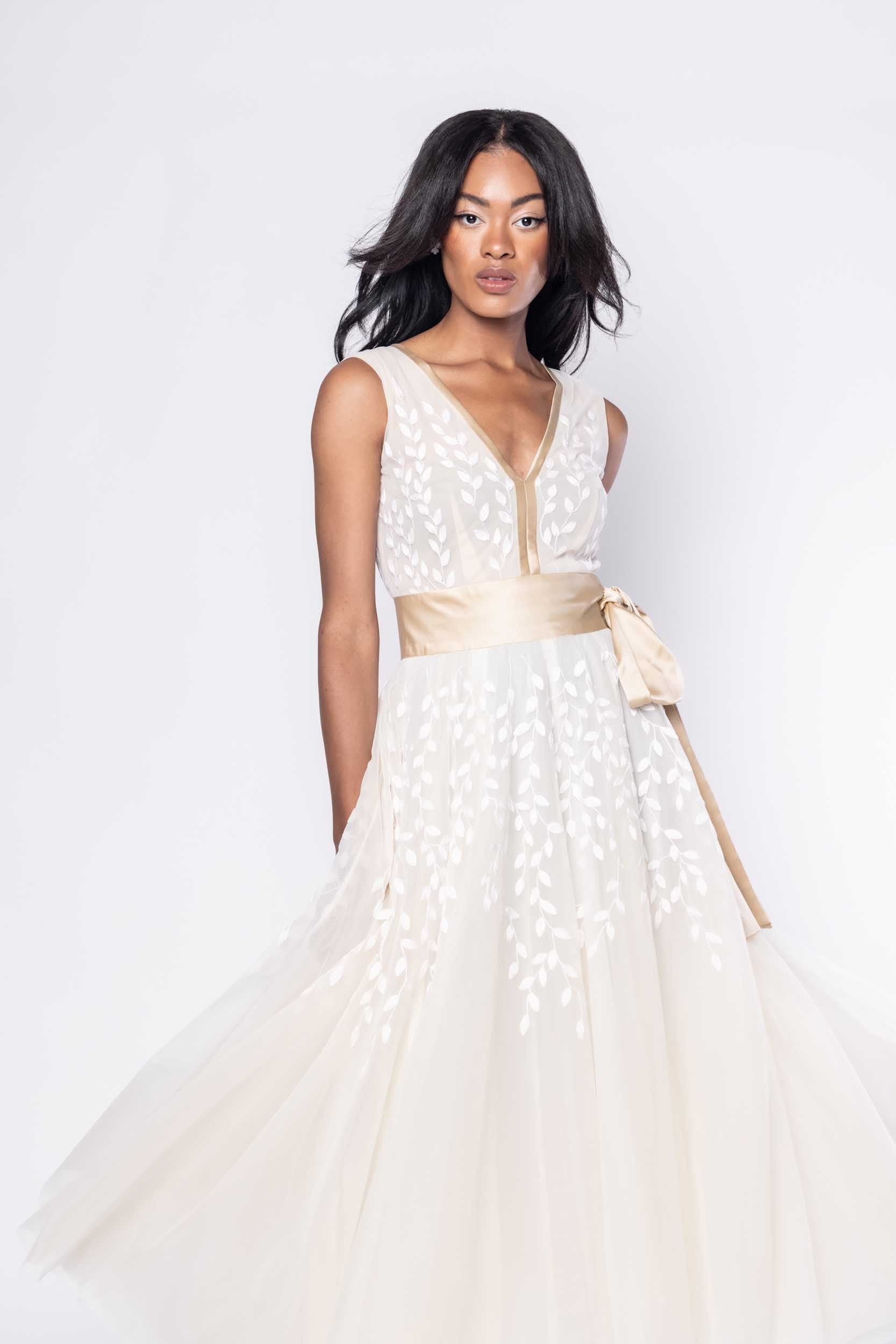 Beautiful model in ornate, nude tea-length Sujata Gazder dress - close view