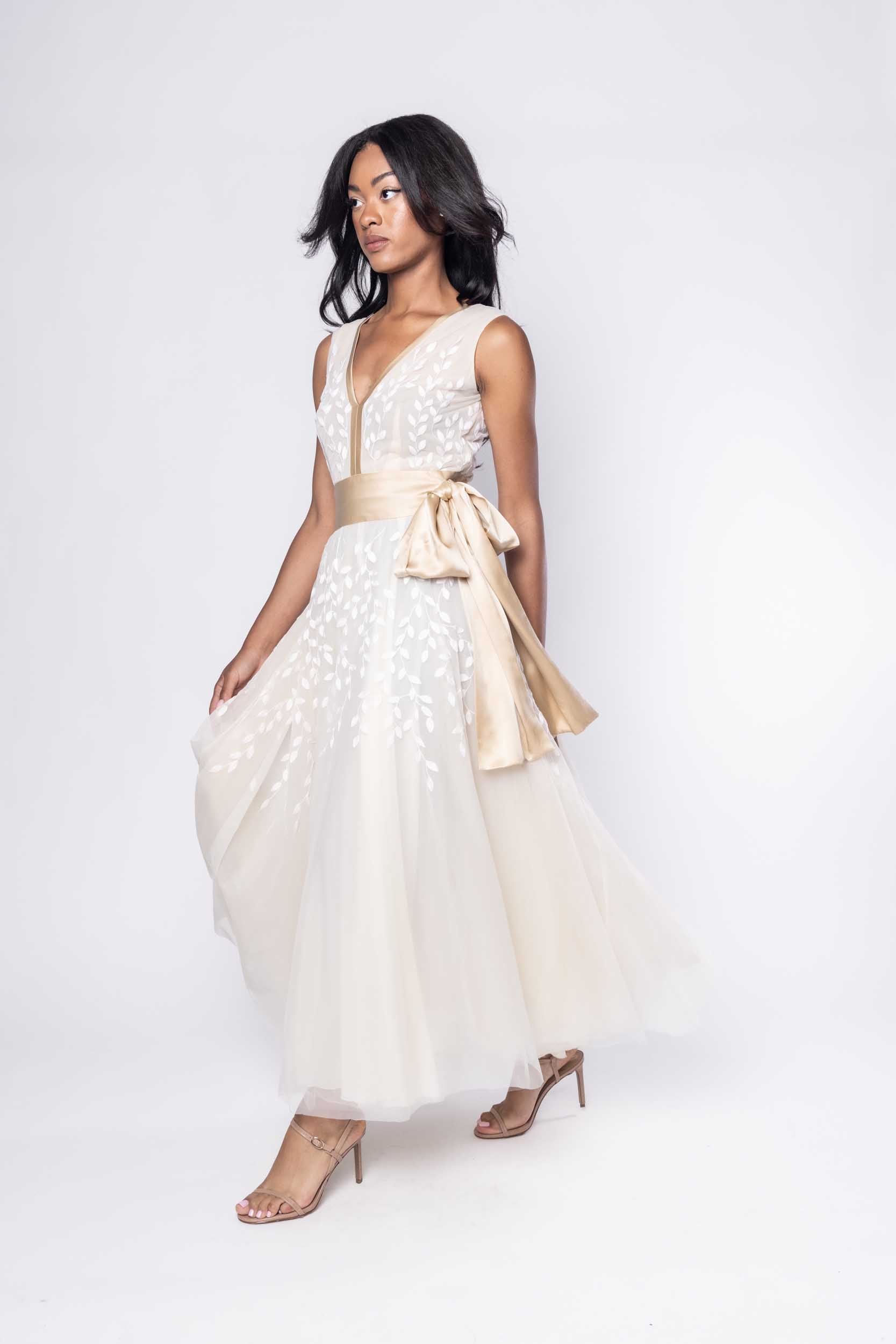 Beautiful model in ornate, nude tea-length Sujata Gazder dress - side view