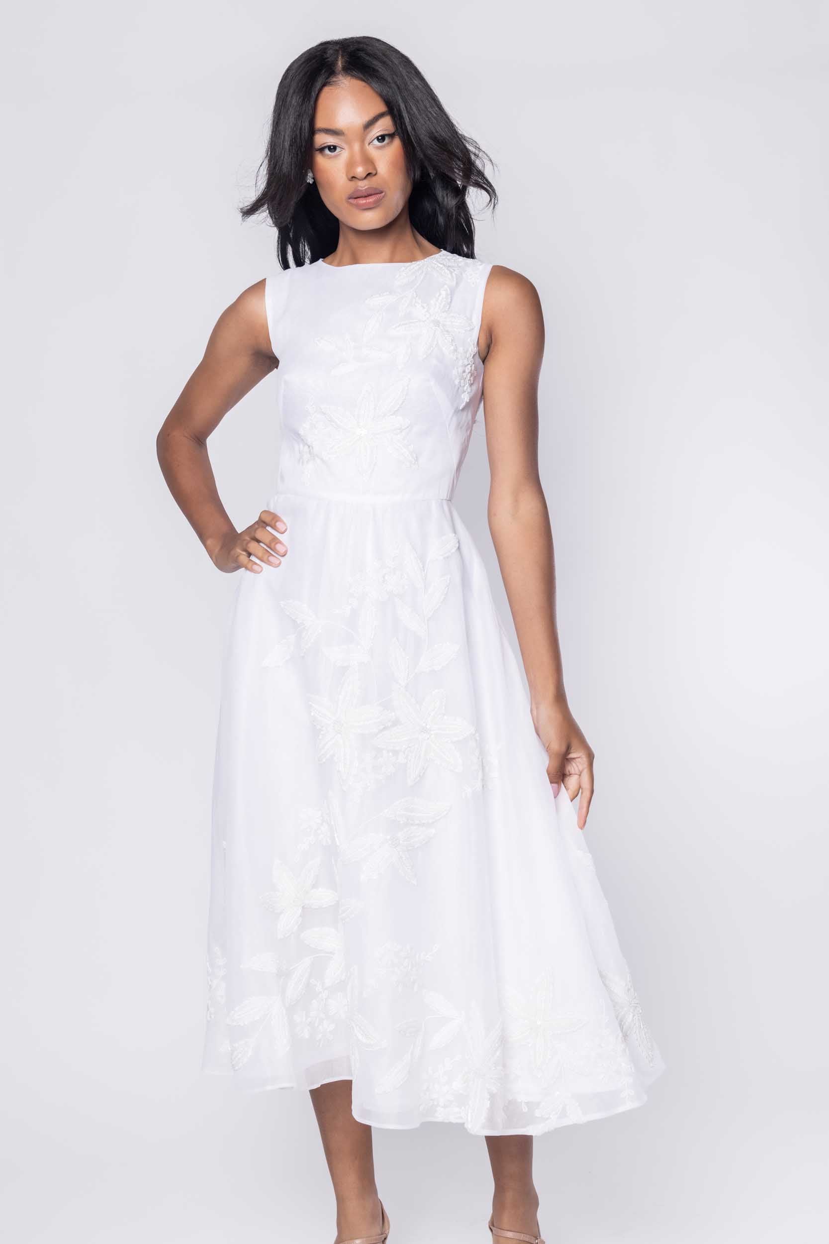 Beautiful model in an embroidered, beaded, ornate Sujata Gazder tea-length dress - close view