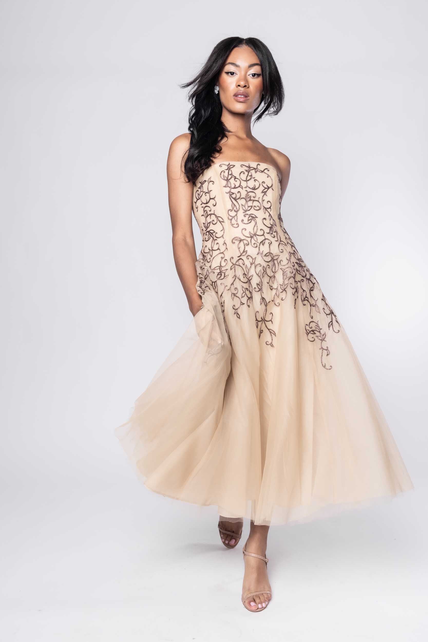 Beautiful model in nude Sujata Gazder dress with ornate stitching - movement view