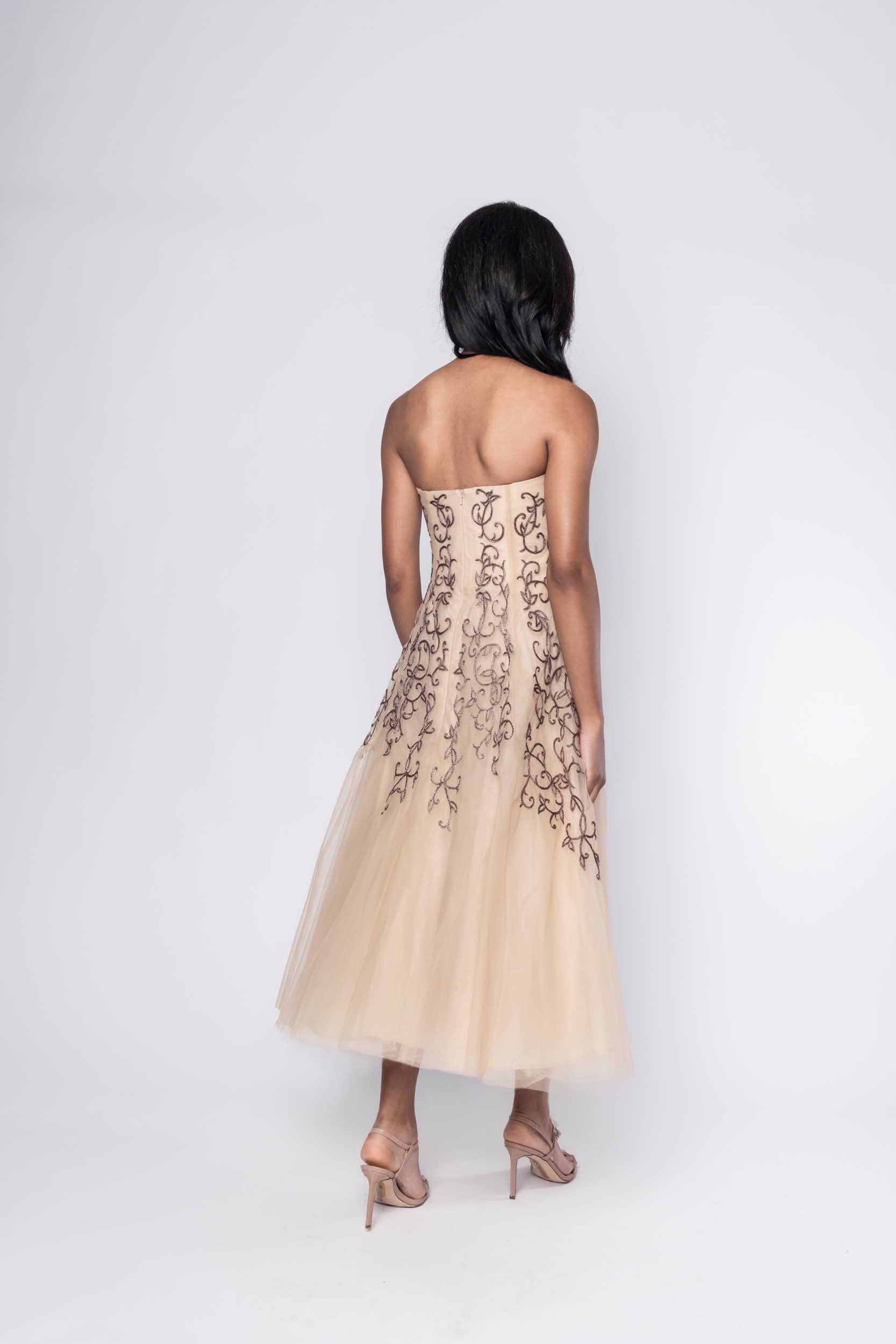 Beautiful model in nude Sujata Gazder dress with ornate stitching - back view