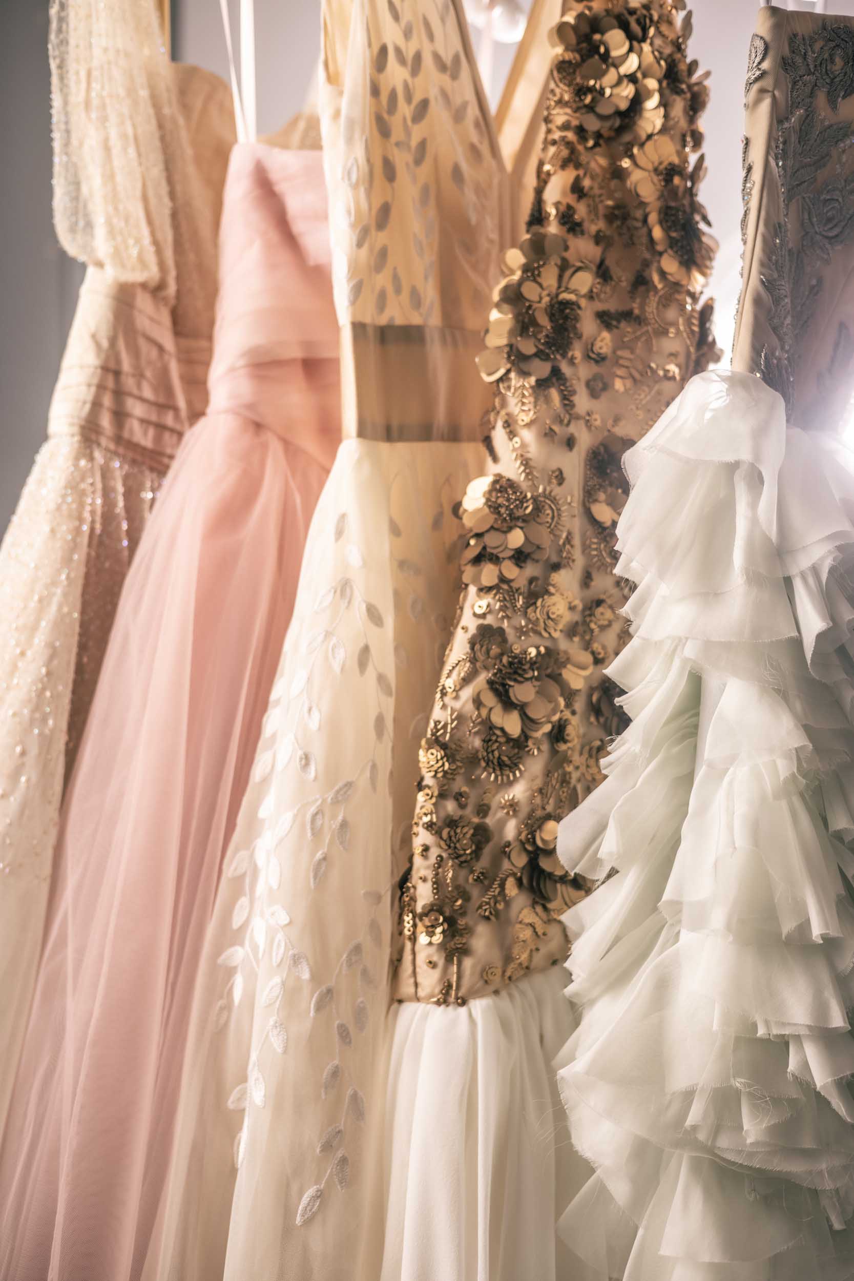 A beautiful rack of pastel and nude Sujata Gazder gowns