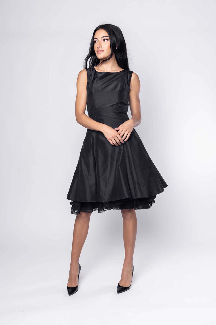 Beautiful model in black cocktail silk Sujata Gazder dress - front view