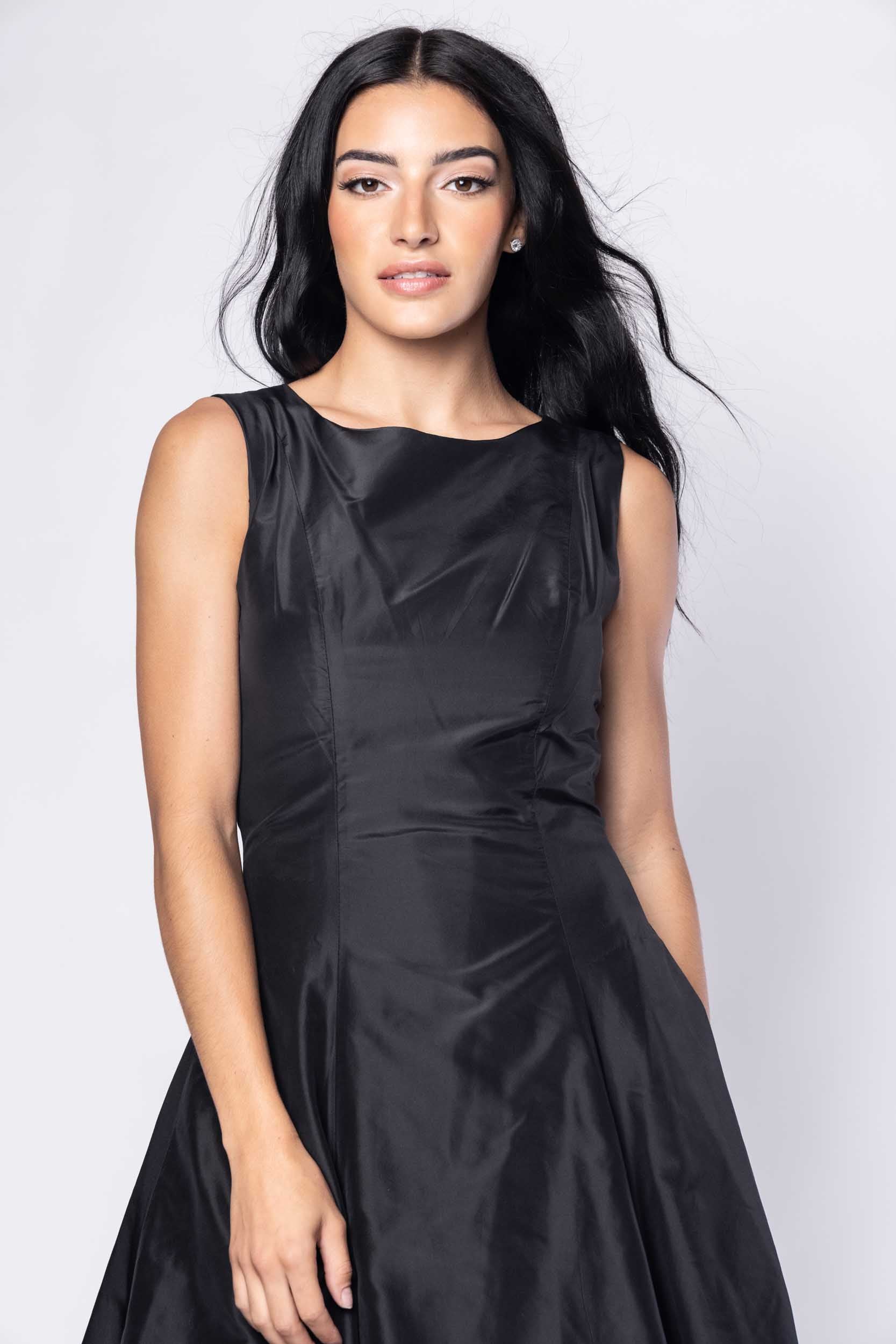 Beautiful model in black cocktail silk Sujata Gazder dress - close view