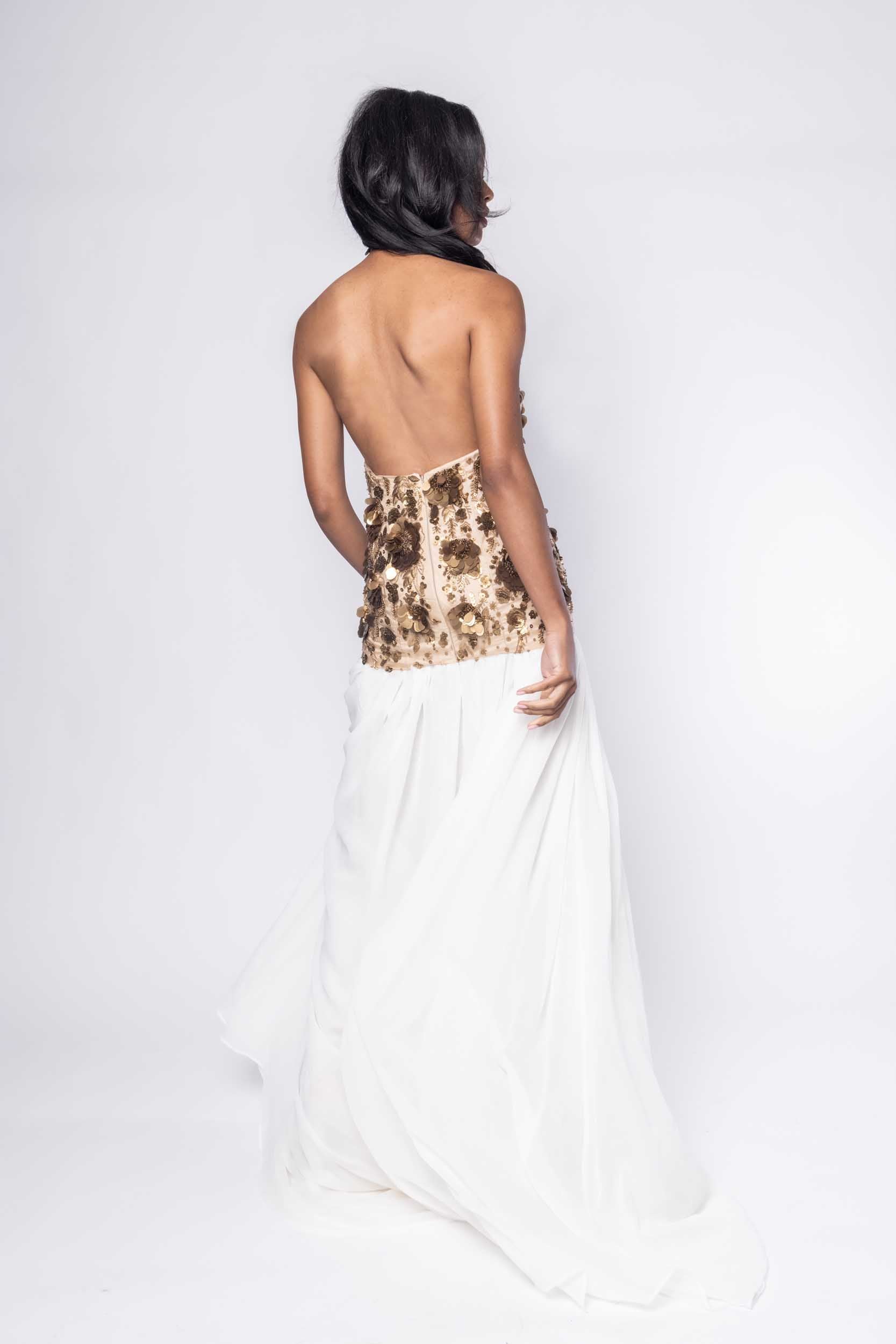 Beautiful model in a sequined and white Sujata Gazder gown - back view
