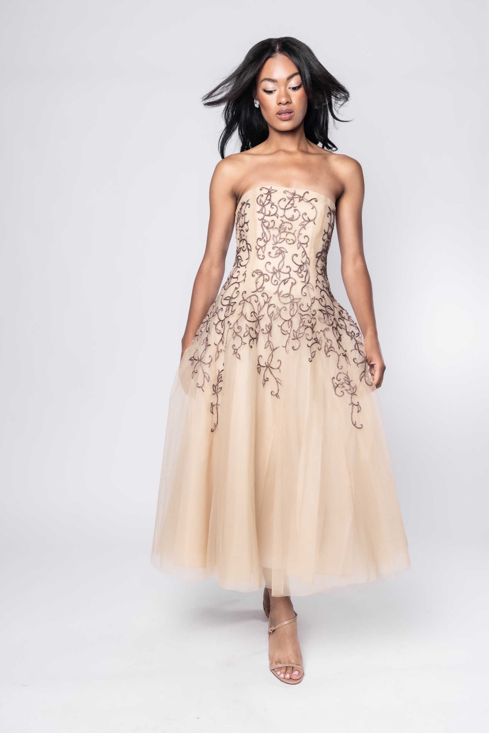 Beautiful model in nude Sujata Gazder dress with ornate stitching - front view movement