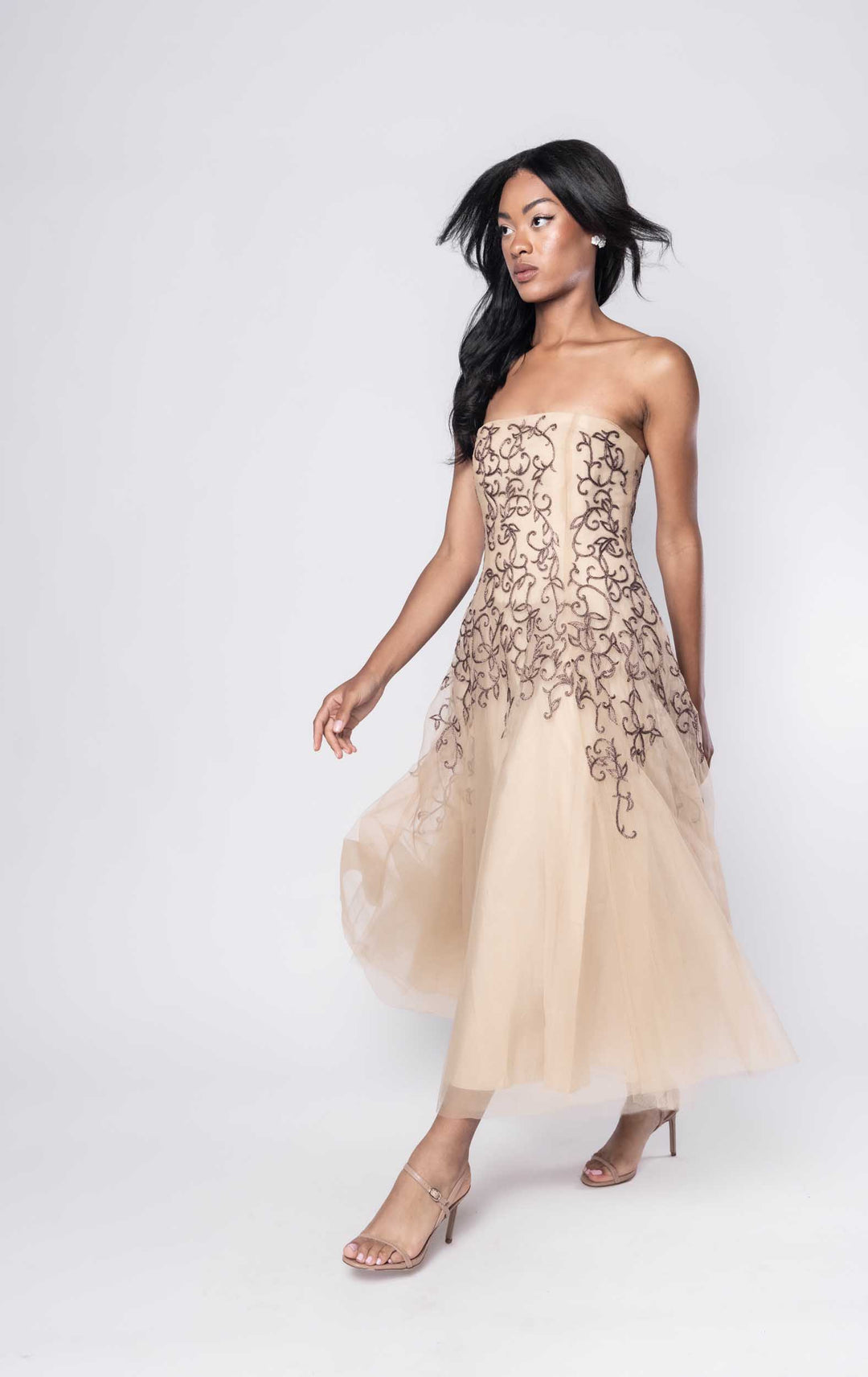 Beautiful model in nude Sujata Gazder dress with ornate stitching - side view