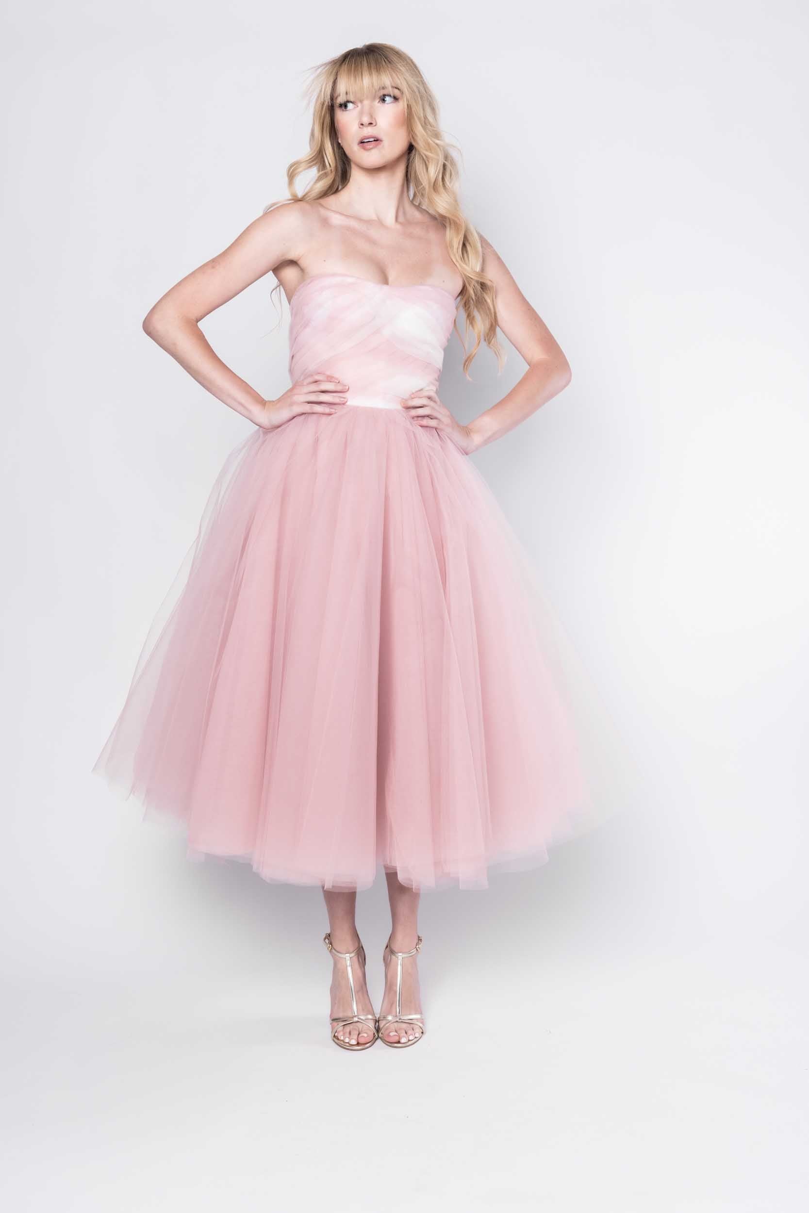 Beautiful model in a pink tulle Sujata Gazder tea-length dress - front view