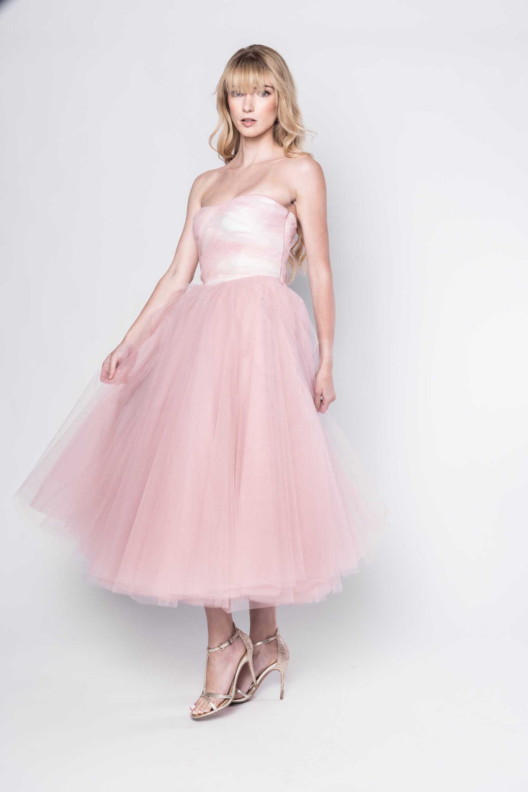 Beautiful model in a pink tulle Sujata Gazder tea-length dress - side view