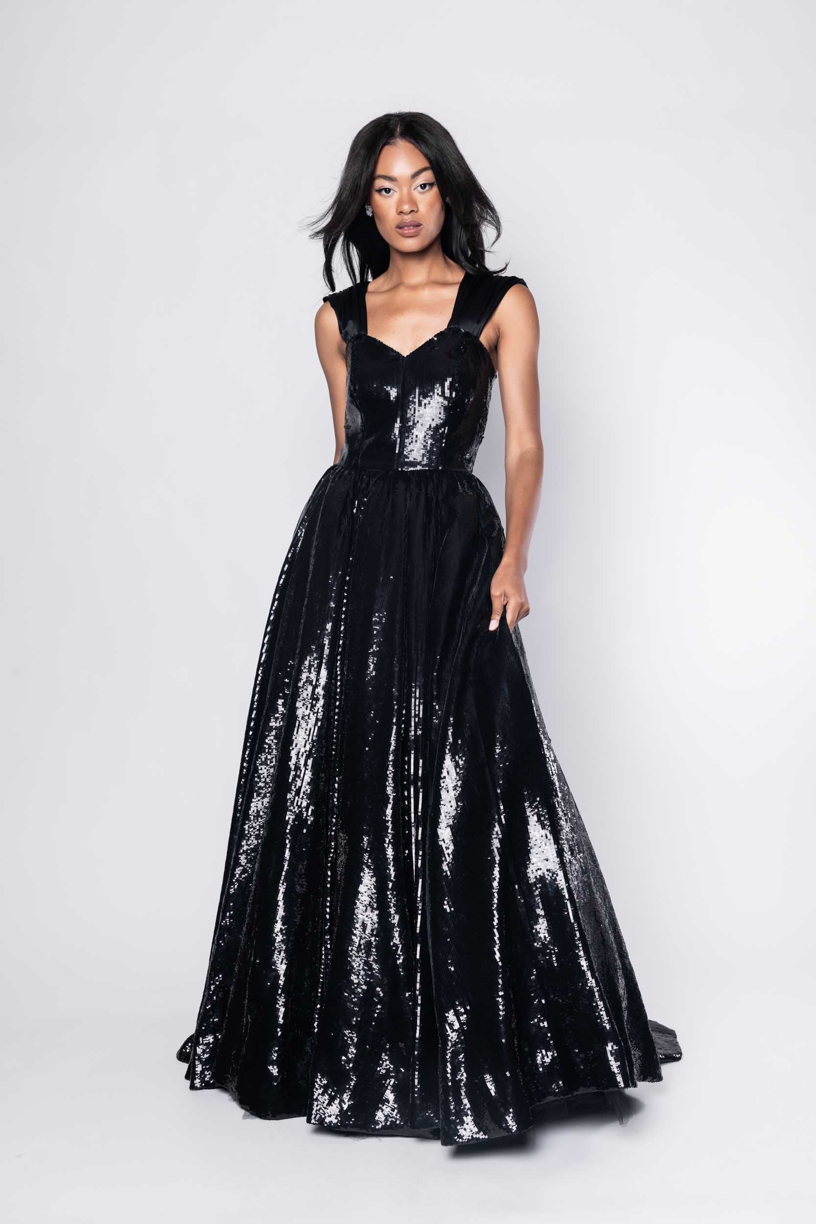 Beautiful model in an sequined, floor-length Sujata Gazder ball gown - front view