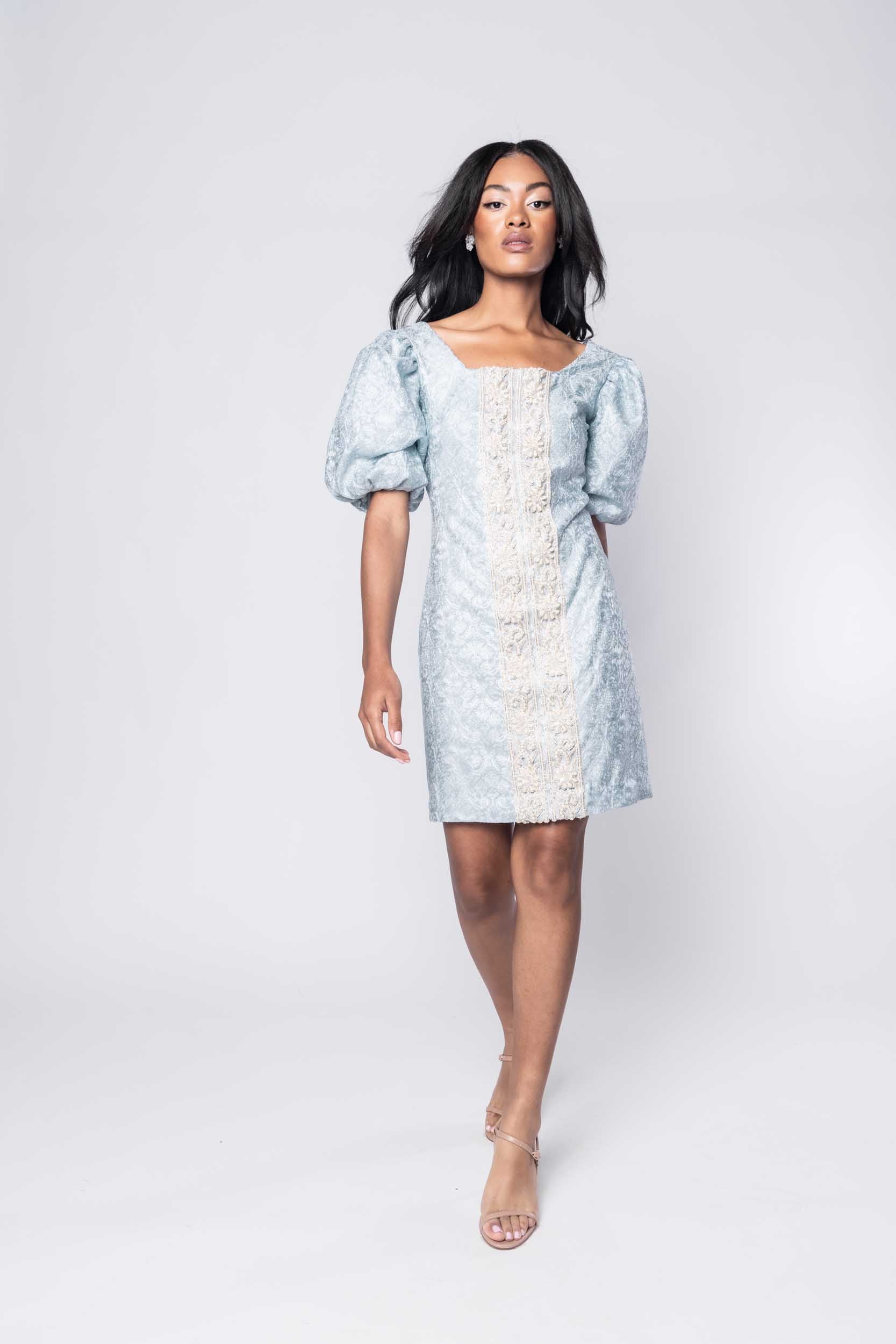 Beautiful model in a pale blue beaded ornate cocktail dress by Sujata Gazder - front view movement